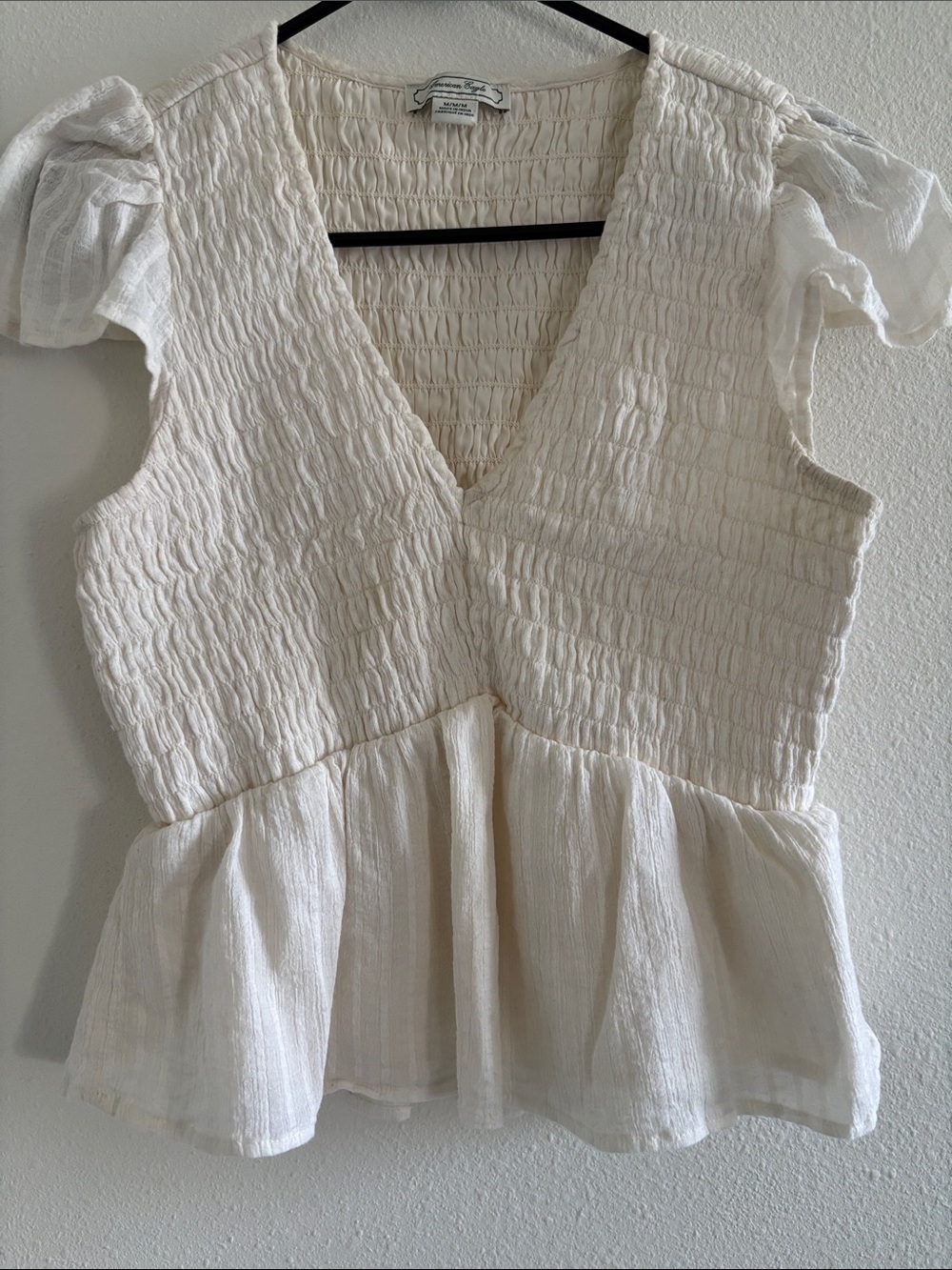 American Eagle Outfitters Cream Smocked Peplum V-Neck Top